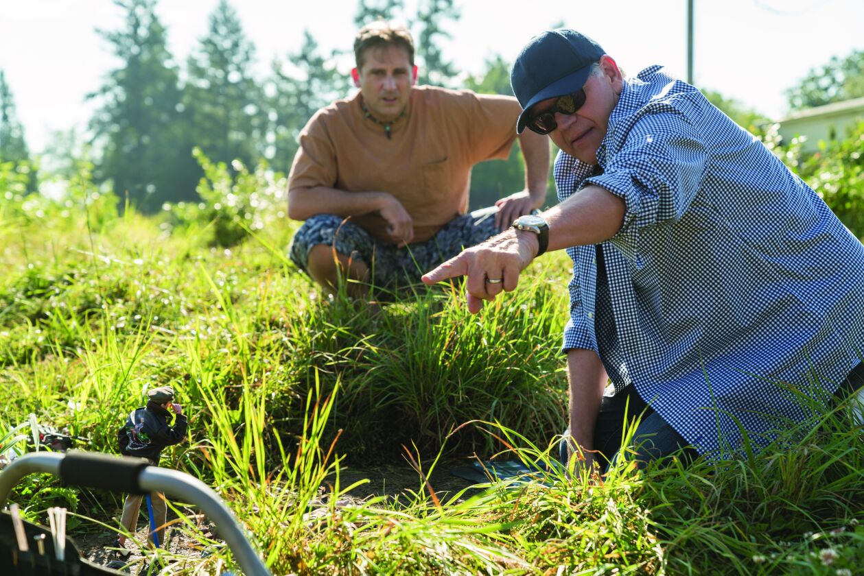 Steve Carell works with director Robert Zemeckis on the set of “Welcome to Marwen.” | Universal Pictures